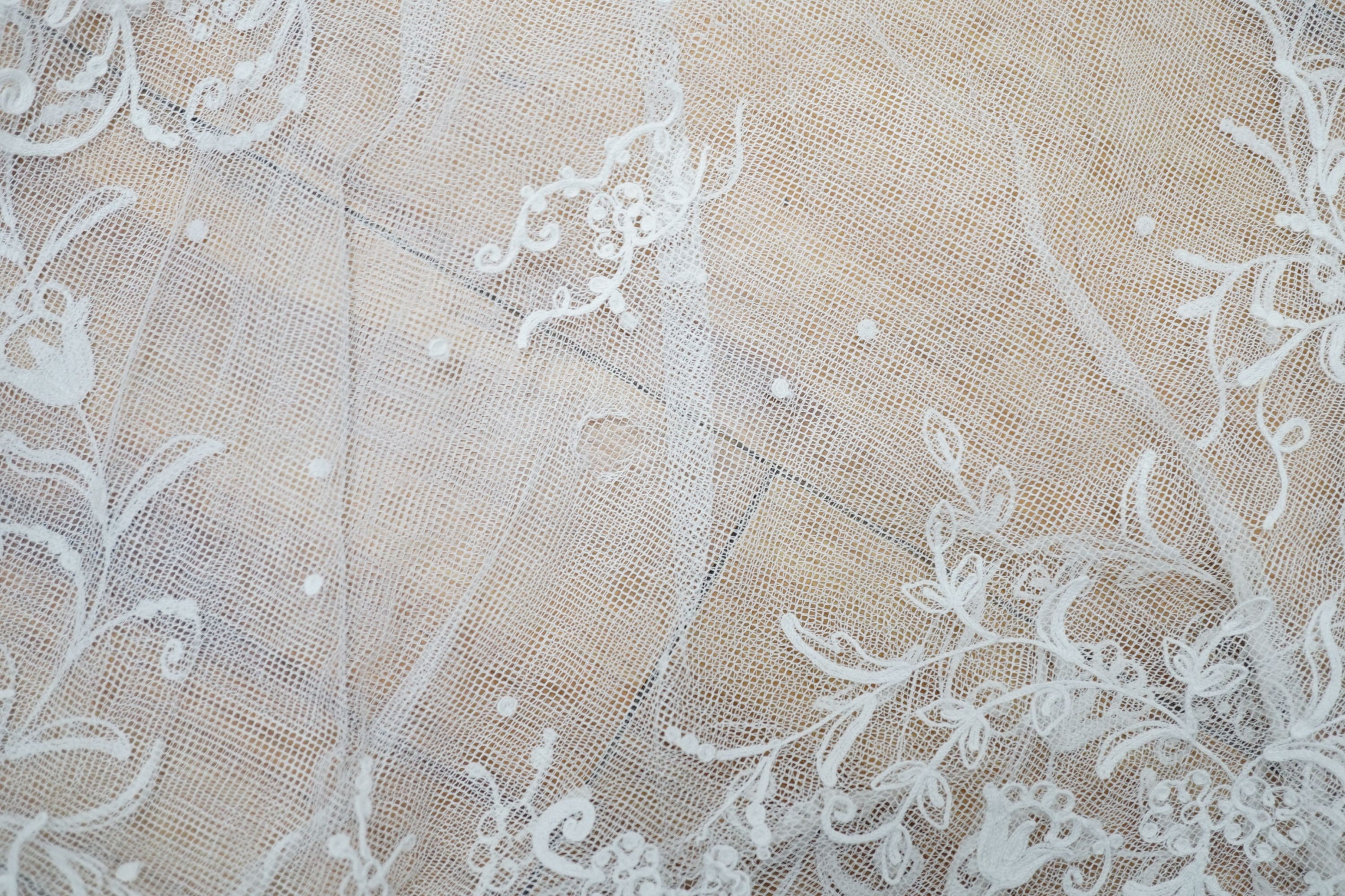 A needle lace skirt panel, a similar stole, various machine laces and trimmings